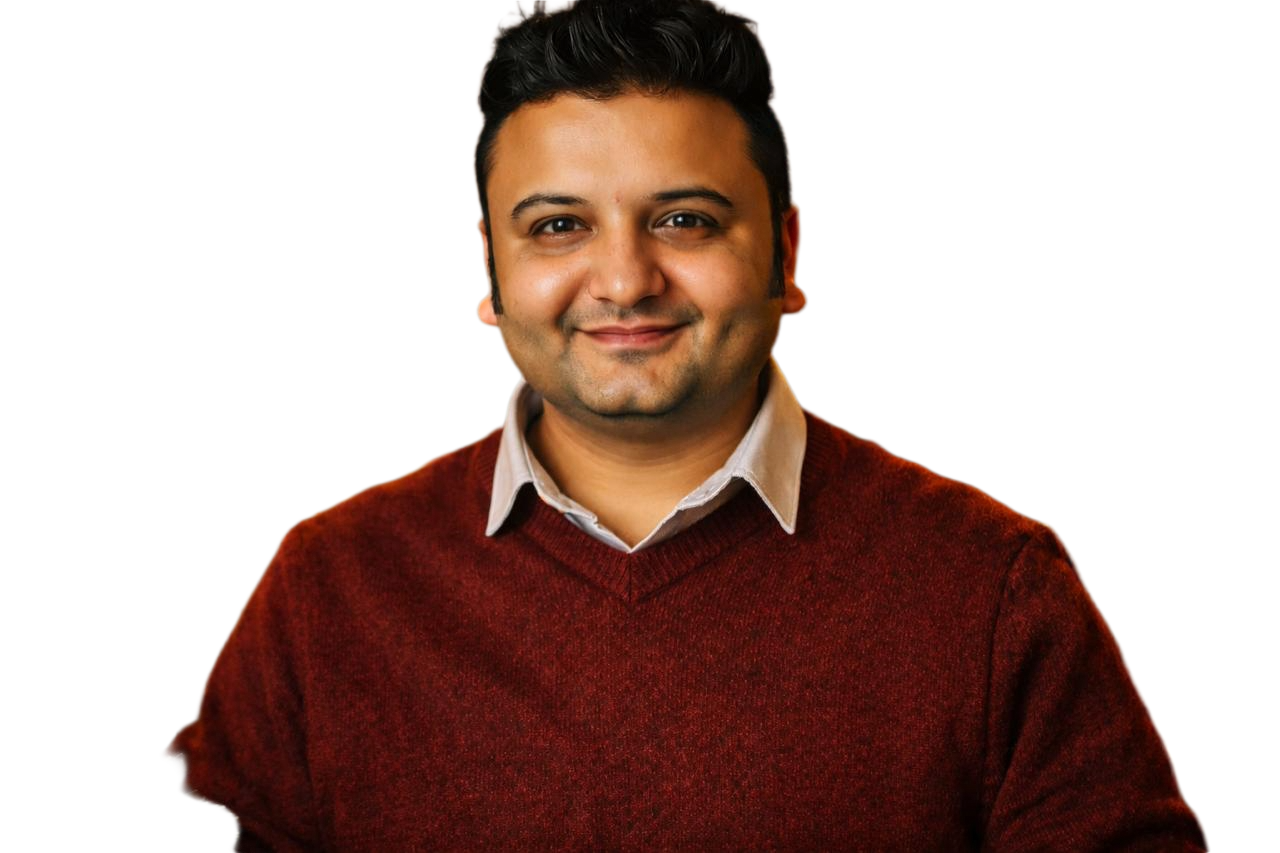Harshit, smiling in a burgundy sweater